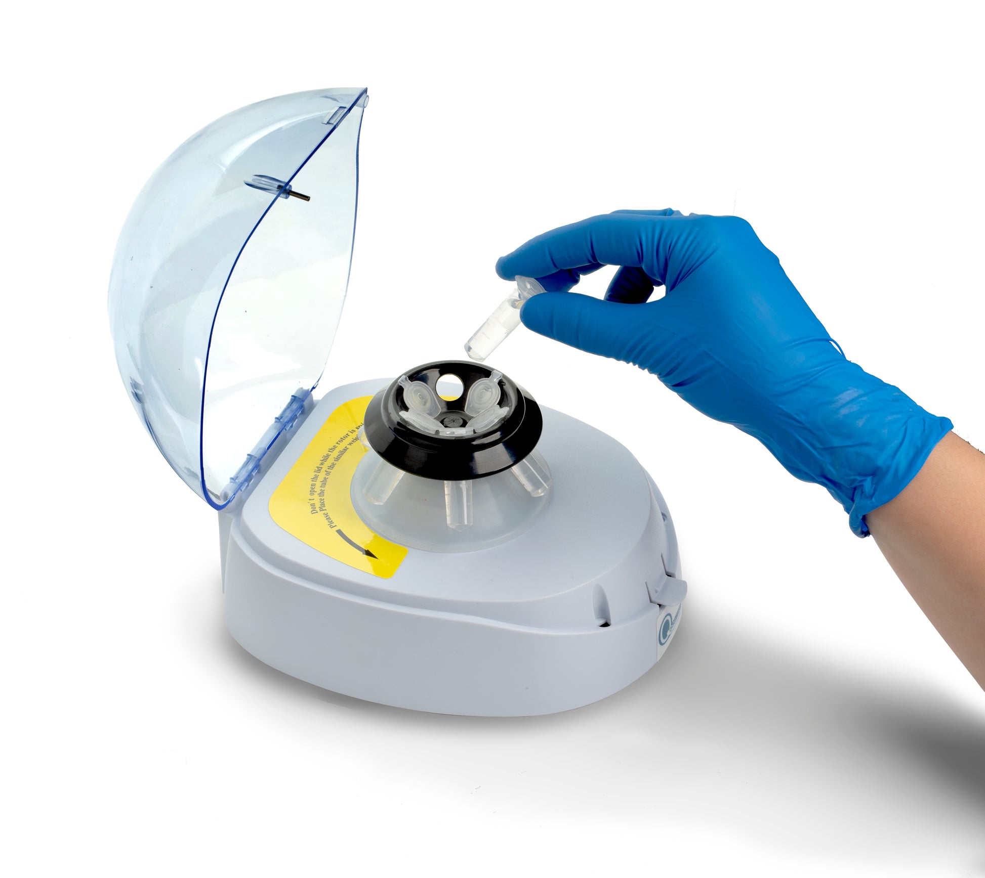 Laboratory technician using Qor Labs 10,000 RPM Mini Centrifuge for sample processing